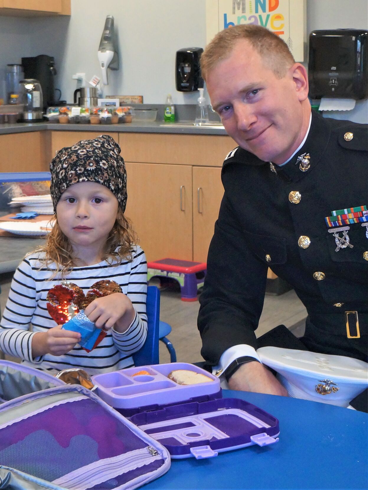 United States Marine Corps veteran Capt. Chris Potsch enjoys a Veterans Day lunch with his daughter Lily